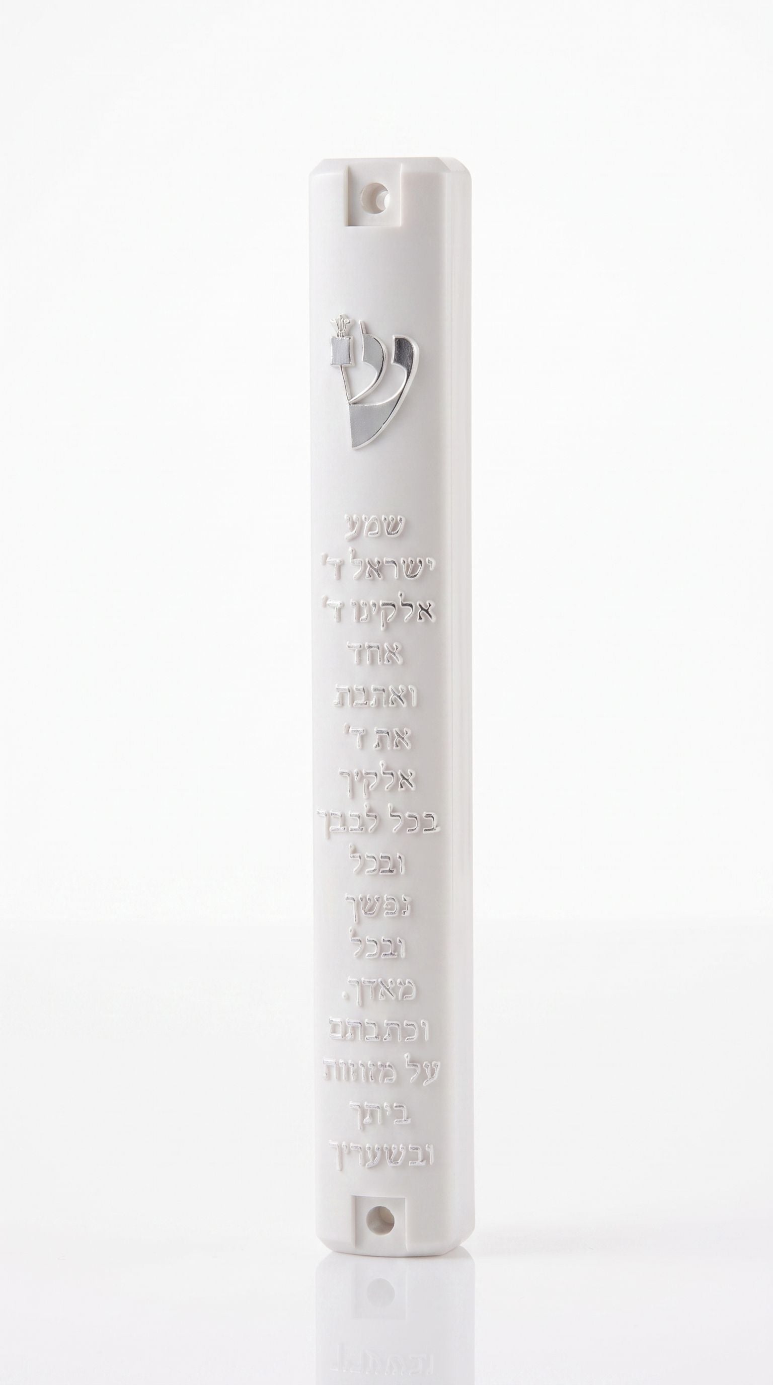 Scripted Shema white acrylic mezuzah case on a white background with raised Hebrew text, a silver Shin and Torah scroll emblem, and top and bottom mounting recesses