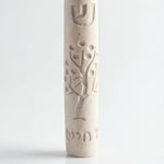 Cream-colored Tree of Life Mezuzah with intricate design for door decor