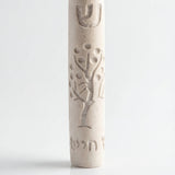Cream-colored Tree of Life Mezuzah with intricate design for door decor