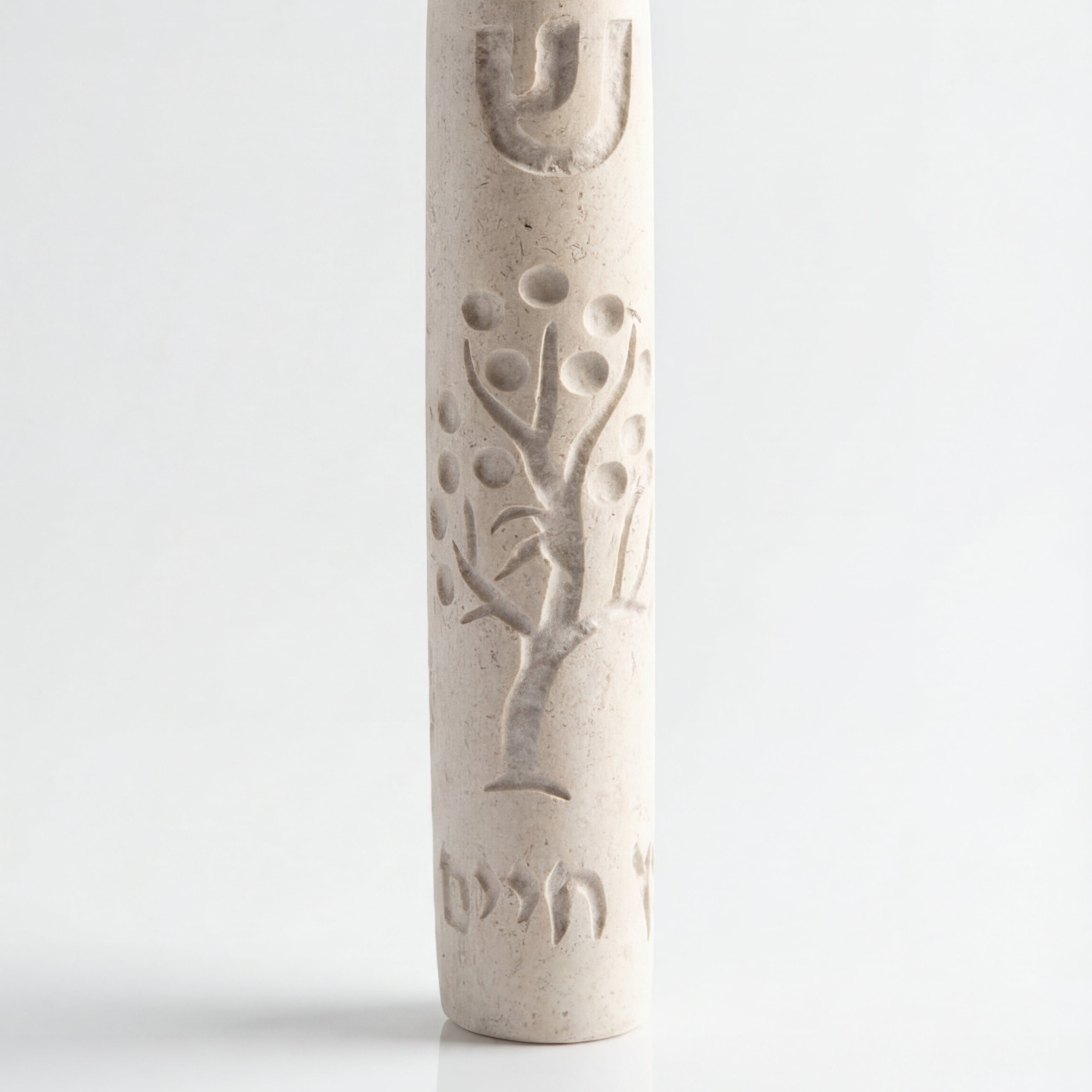 Cream-colored Tree of Life Mezuzah with intricate design for door decor