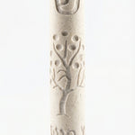 Cream Jerusalem stone Mezuzah with intricate design and Hebrew inscription, displayed vertically on a white studio surface with a soft reflection.