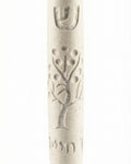 Cream-colored Jerusalem stone Tree of Life Mezuzah with engraved Hebrew letters and decorative motifs, on a white background with a soft reflection.
