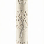 Cream-colored Jerusalem stone Tree of Life Mezuzah with engraved Hebrew letters and decorative motifs, on a white background with a soft reflection.