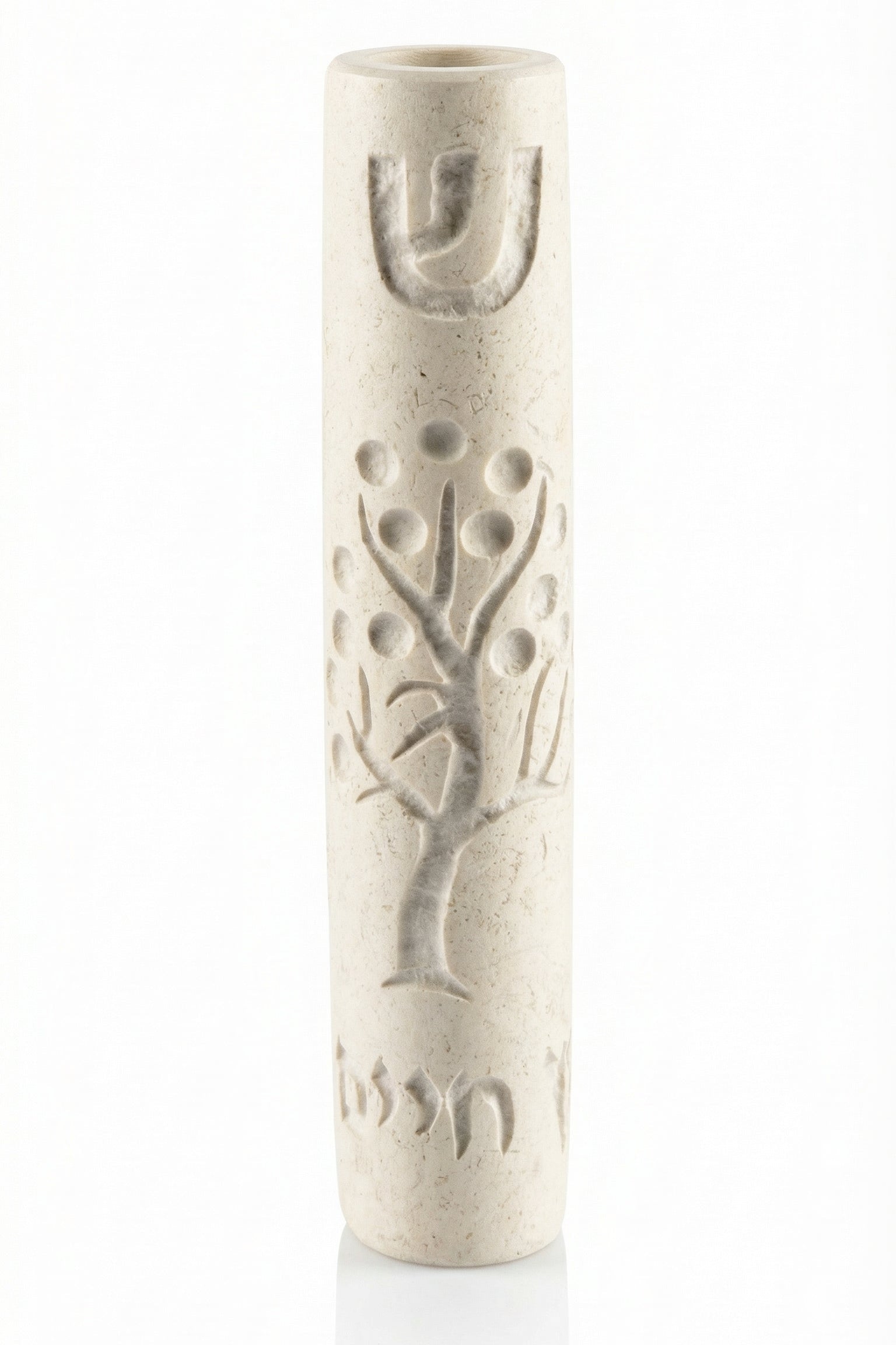 Cream-colored Jerusalem stone Tree of Life Mezuzah with engraved Hebrew letters and decorative motifs, on a white background with a soft reflection.