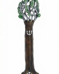 Pewter Tree of Life Mezuzah reflecting symbolism of the Torah as a tree of life, detailed engraving, on a white studio surface with soft reflection.