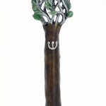 Pewter Tree of Life Mezuzah reflecting symbolism of the Torah as a tree of life, detailed engraving, on a white studio surface with soft reflection.