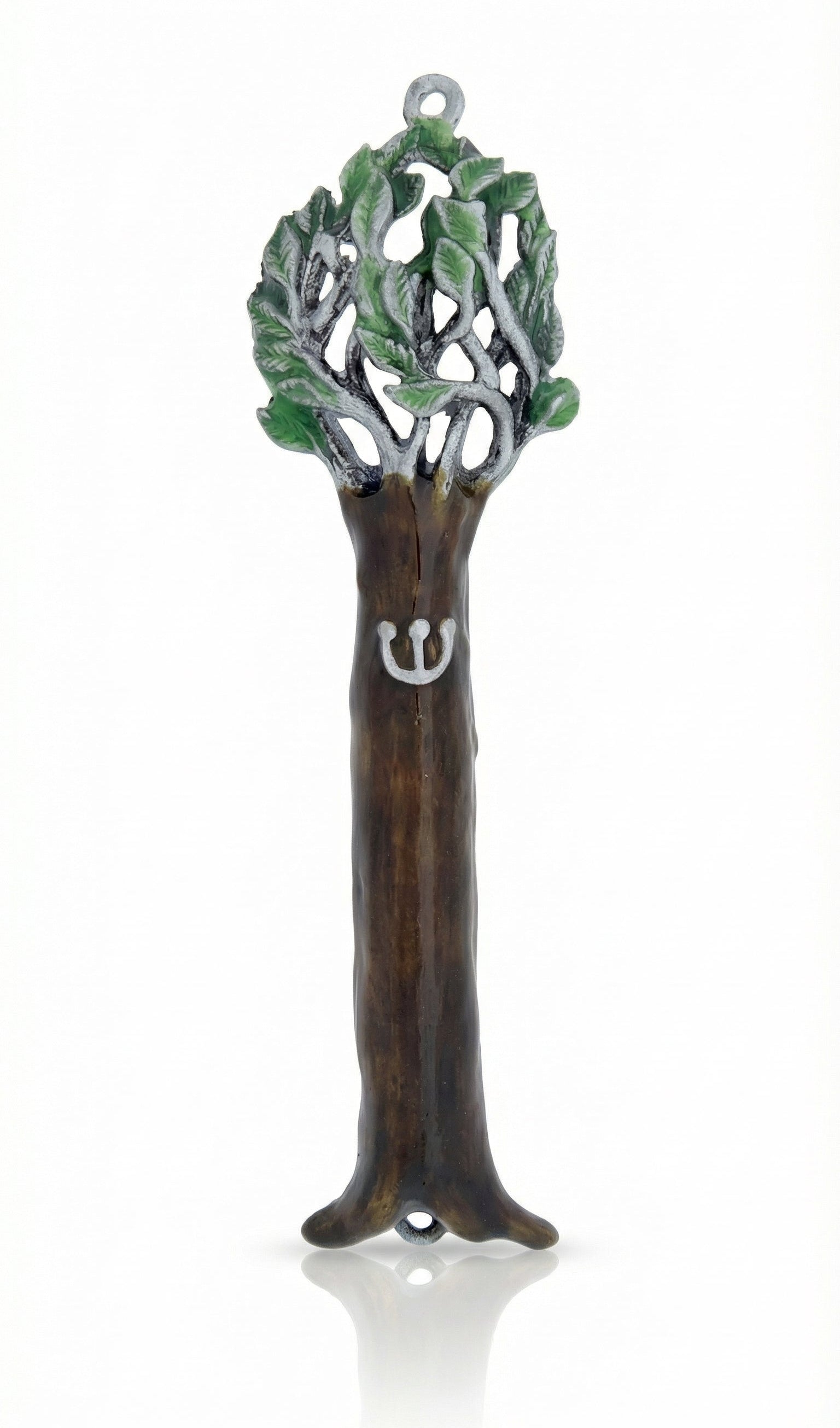 Pewter Tree of Life Mezuzah reflecting symbolism of the Torah as a tree of life, detailed engraving, on a white studio surface with soft reflection.