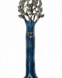 Pewter mezuzah with blue enamel depicting the tree of life, finely detailed and oriented vertically, on a white background with a subtle reflection.