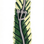 Upscaled, detailed image of a pewter mezuzah with tropical palm leaf design, hand painted with enamel, on a white studio background with soft reflection.