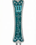 Turquoise Birchat Cohanim Mezuzah with Hebrew Priestly Blessing inscribed, adorned with detailed carvings, on a white studio background with a light reflection.