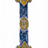 Elegant Tzfat Mezuzah with blue enamel and detailed Kabbalistic motifs, made of pewter, displayed on a white studio surface with a subtle reflection.