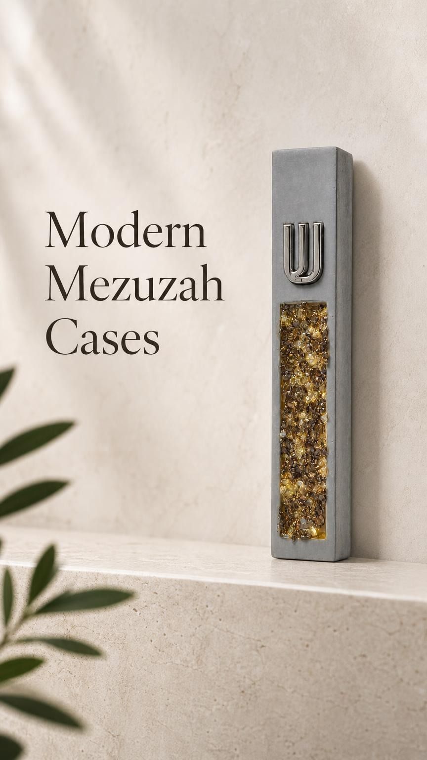 Close product view of a unique gray cement mezuzah case with a raised silver-tone Shin and long decorative inlay filled with golden amber, honey, bronze, and warm crystal and glass tones, styled against a clean contemporary background on a stone surface