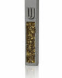 Gray cement mezuzah case with golden amber crystal and glass inlay reflecting champagne, honey, bronze, and a raised silver Shin
