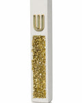 White cement mezuzah case with golden crystal and glass inlay, champagne reflections, and a raised gold Shin