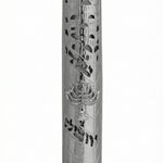 Pewter mezuzah with cutouts revealing scroll, menorah motif, and Jerusalem inscription, designed for religious home decor.