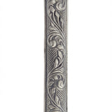 Detailed vintage Moroccan pewter mezuzah with Hebrew inscriptions, on a white studio background with a subtle reflection.
