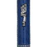 Embellished pewter Mezuzah with Hebrew sha-dai in a professional studio setting on a white background, with soft reflection.