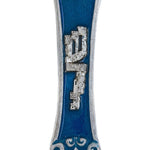 Pewter mezuzah featuring the 'Sha-dai' name built as city walls, with Hebrew letters, decorative motifs, and a white studio background.