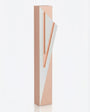 Modern Capital Shin pink aluminum mezuzah case on white with a soft pink body and a large angular silver Hebrew Shin