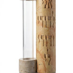 Elegant handcrafted Jerusalem stone Mezuzah with Hebrew inscription, natural stone variations, and polished white studio background with subtle reflection.