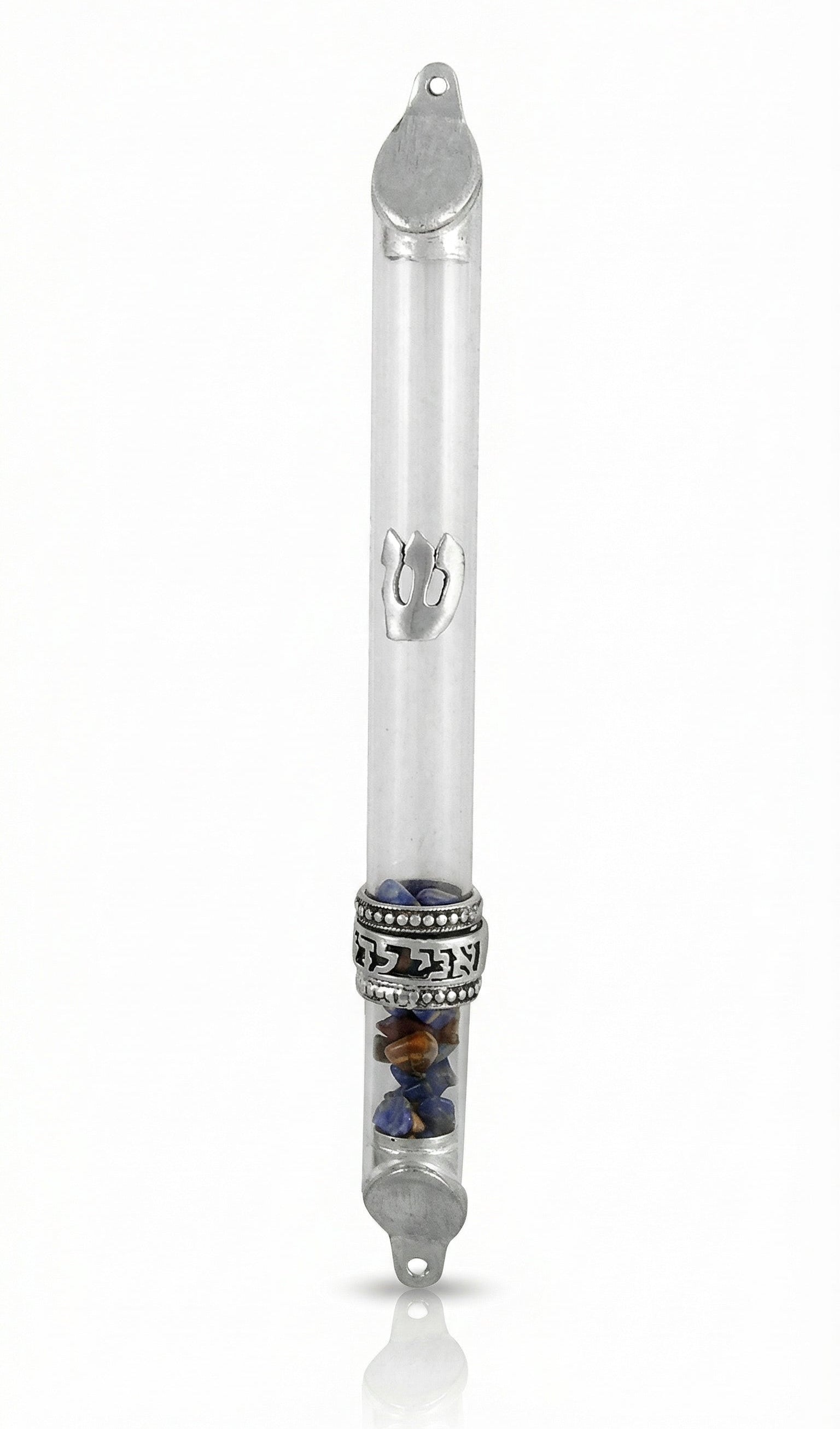 Elegant wedding glass mezuzah with sterling silver wedding ring, engraved Hebrew words, in a bright white studio setting with soft reflection.