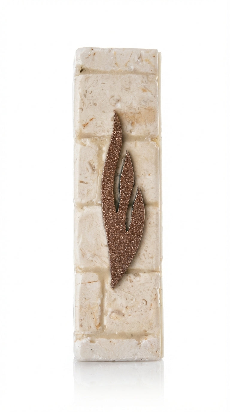 Handcrafted Mezuzah made from authentic Jerusalem stone, featuring detailed Hebrew engravings, set against a clean white background with subtle reflection.