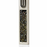 White and silver cement kosher mezuzah case with a raised Hebrew Shin and iridescent stone-style inlay.