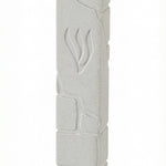White cement mezuzah measuring 6 inches tall with Hebrew engravings, mounted with strong adhesive on a white studio background with soft reflection.