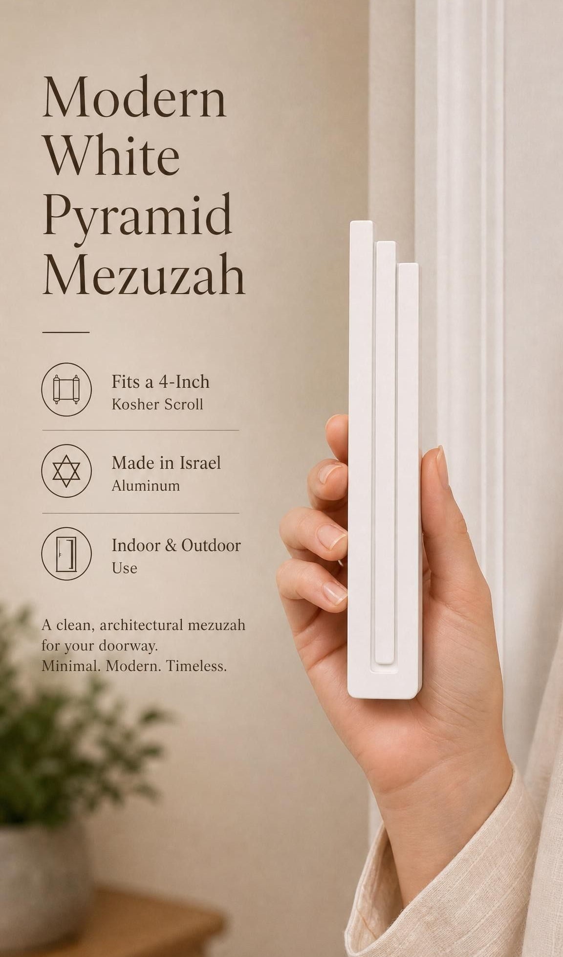 Person holding the modern white pyramid mezuzah with space for editorial text of mezuzah features
