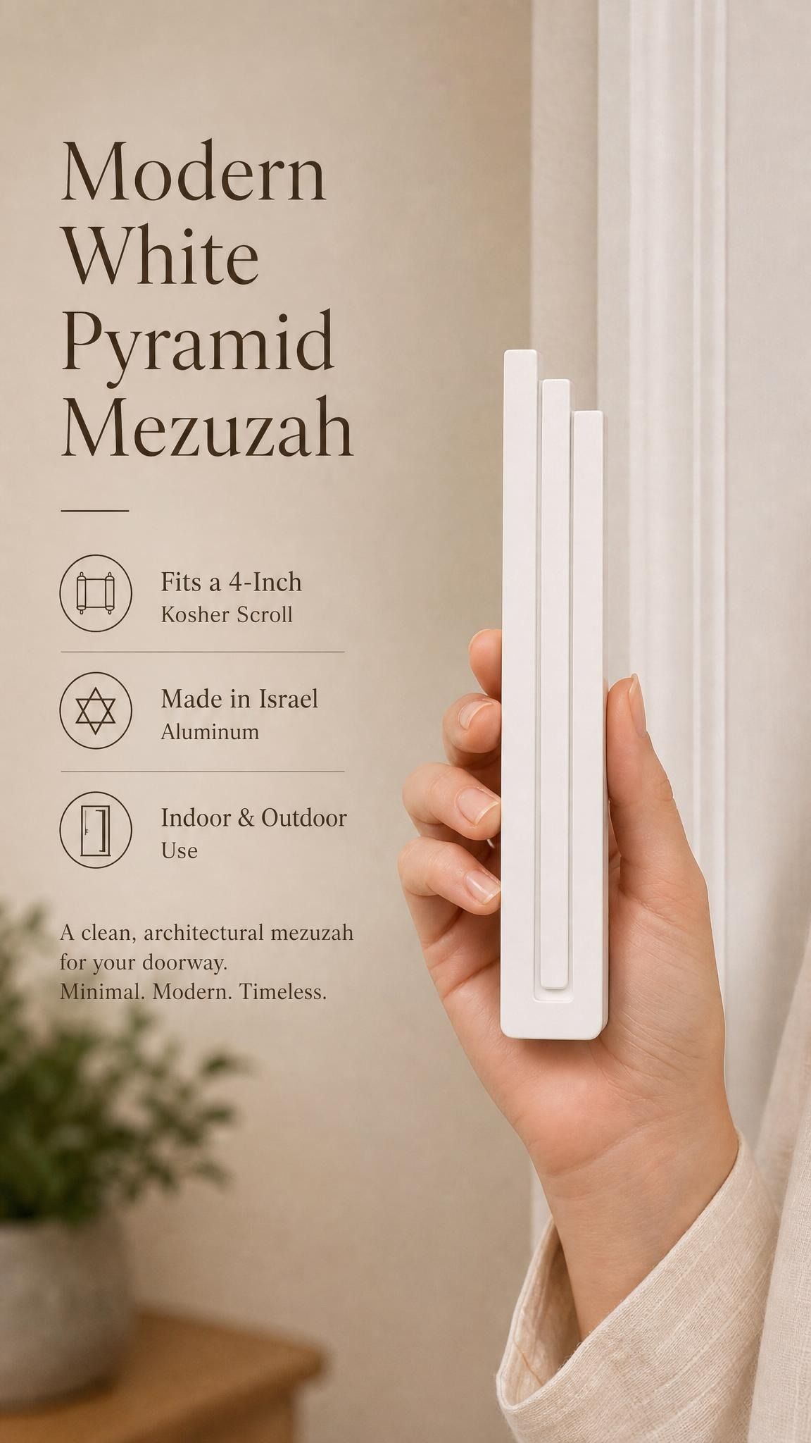 Person holding the modern white pyramid mezuzah with space for editorial text of mezuzah features