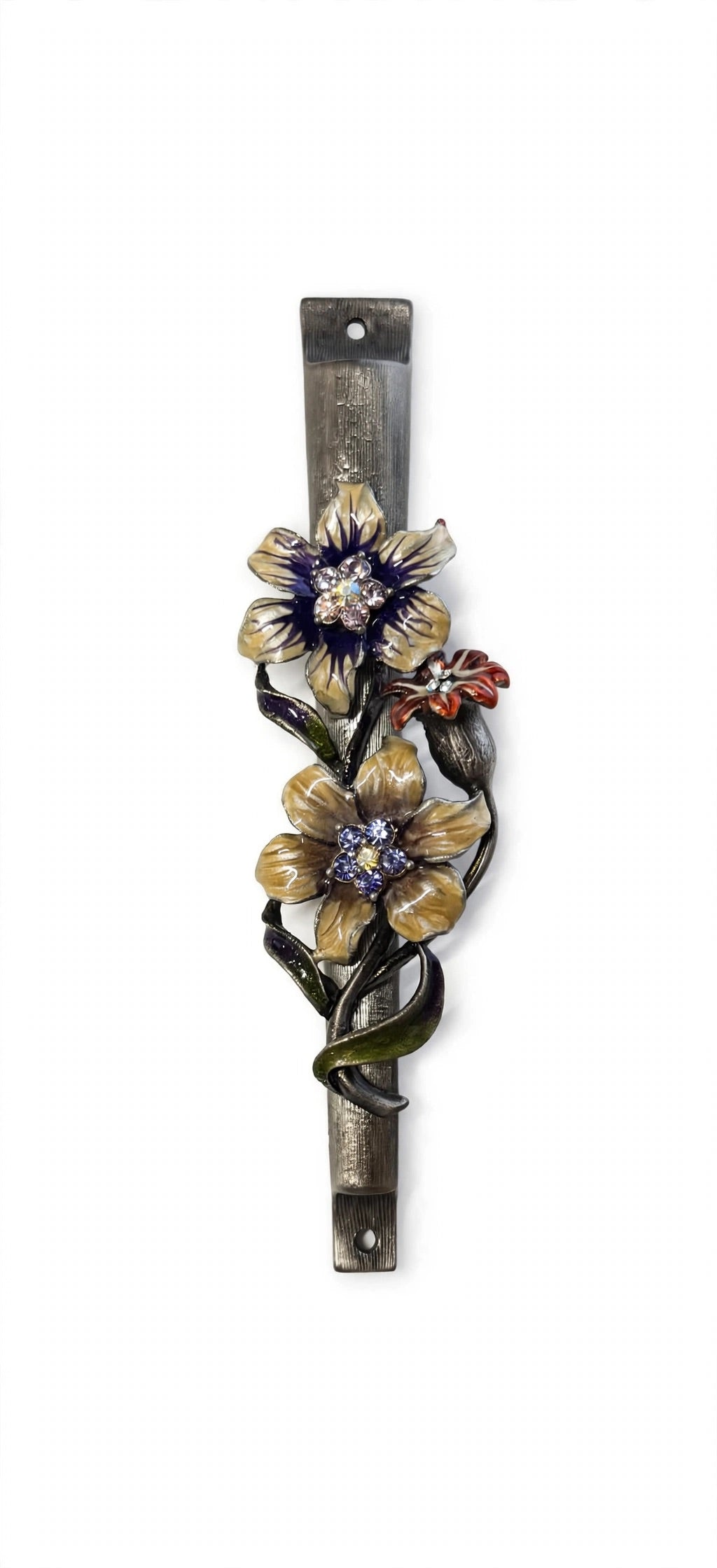 Wildflower Garden Pewter Mezuzah shown from the front as a mezuzah cover featuring yellow and purple flowers with sparkling centers, a small reddish blossom and green curling leaves along a textured silver-toned pewter stem, presenting a detailed Judaica design for a Jewish home doorway
